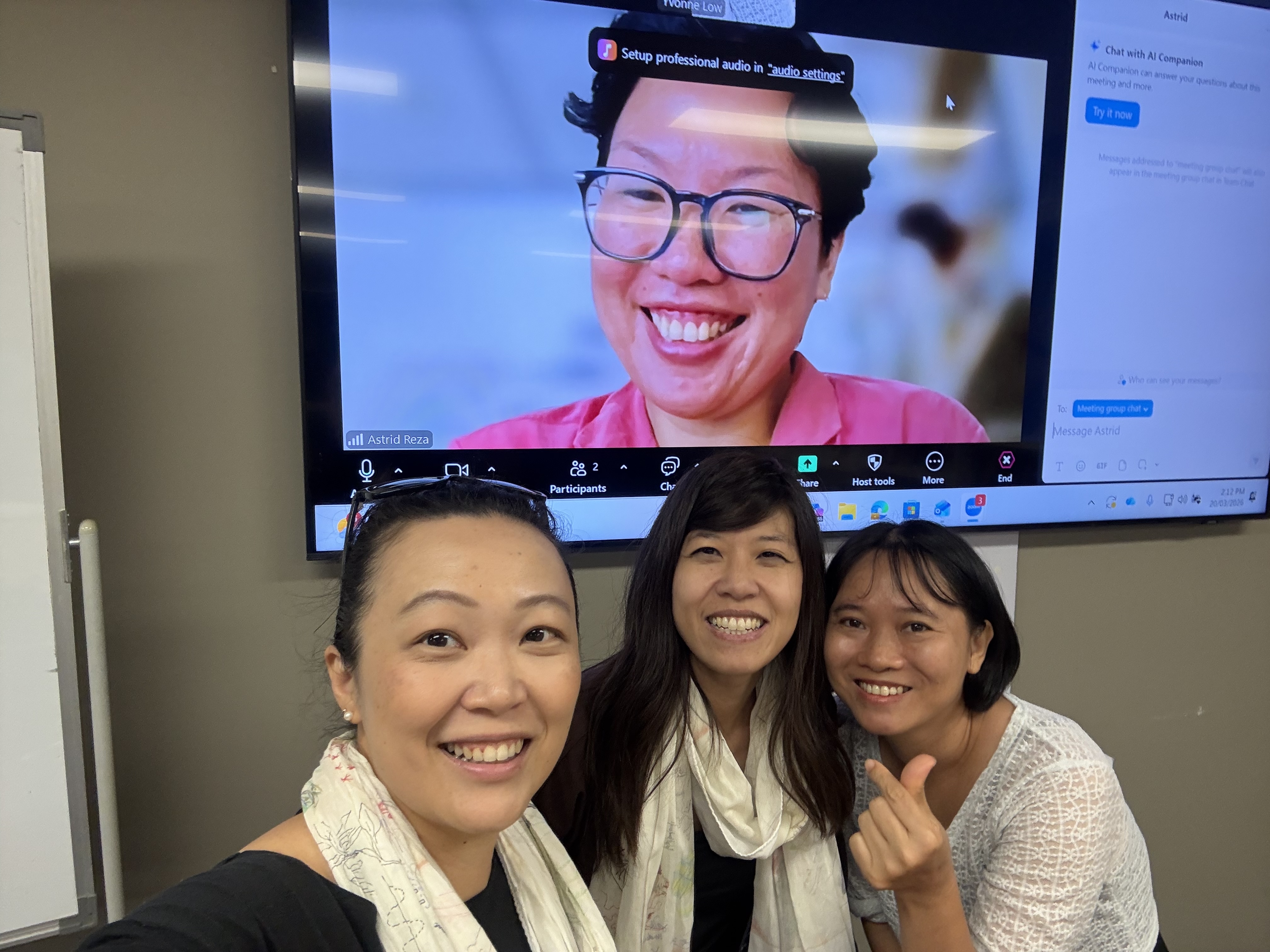 group photo in front of screen